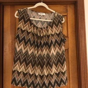 Tank style blouse. Neutral colors.